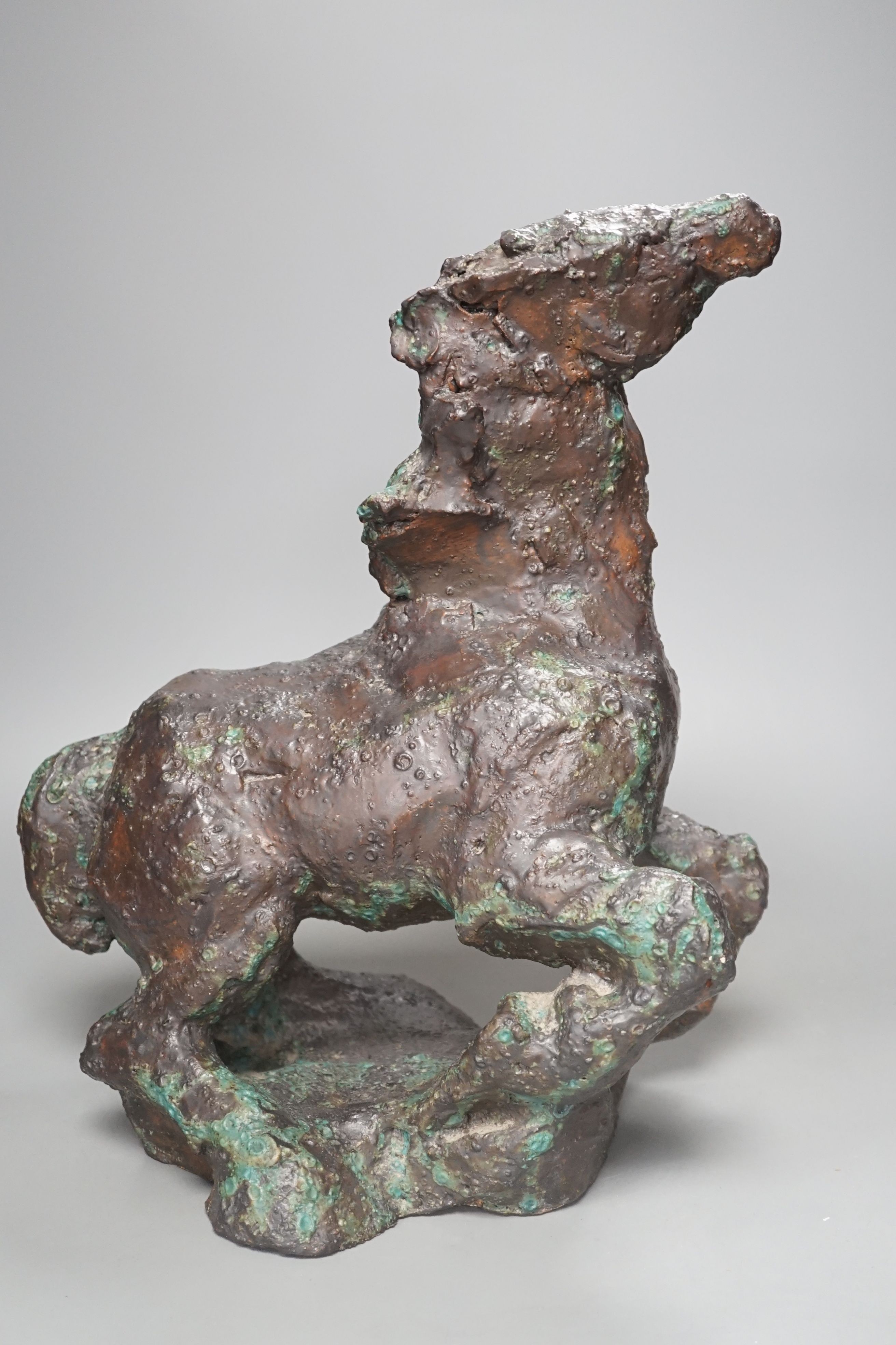 A large abstract bronzed pottery model of a horse horse, 38 cms high.